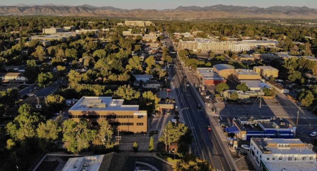 Wheat Ridge neighborhood aerial with mountains